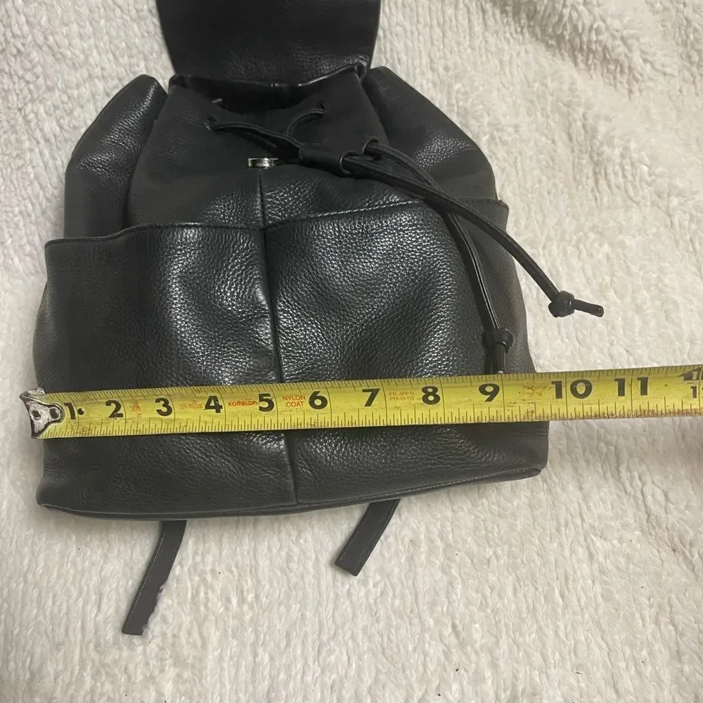 Tignanello Leather Black small Backpack string straps closure.